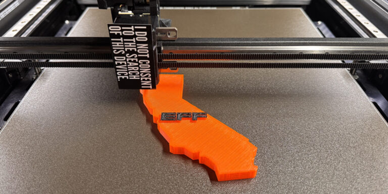 Photo of a 3D printer printing the state of california with the EFF logo
