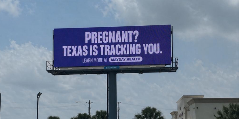 Photo of a billboard that reads "PREGNANT? TEXAS IS TRACKING YOU. LEARN MORE AT MAYDAY.HEALTH"